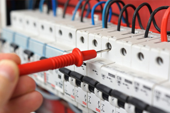 Electrician Servicing Electrical Switchgear