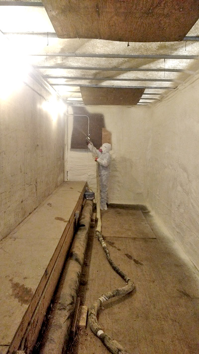 Contractor Spraying Insulation